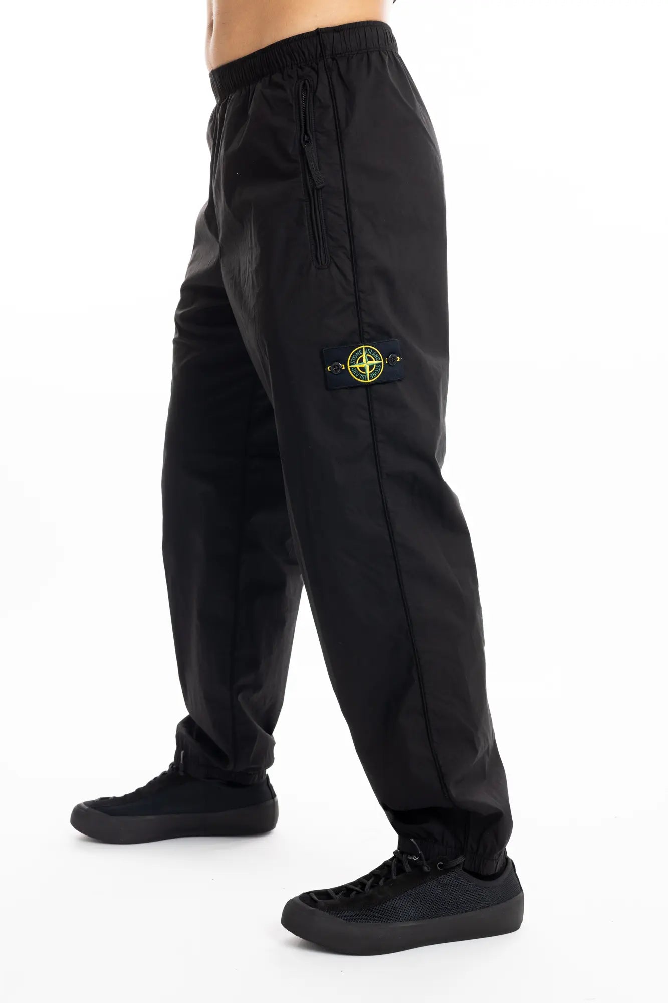 Stone Island, Mens Pants, Black, Elasticated cuffs and waistband, Compass badge, Zip Side Pockets, YKK Zippers, Side Photo. 