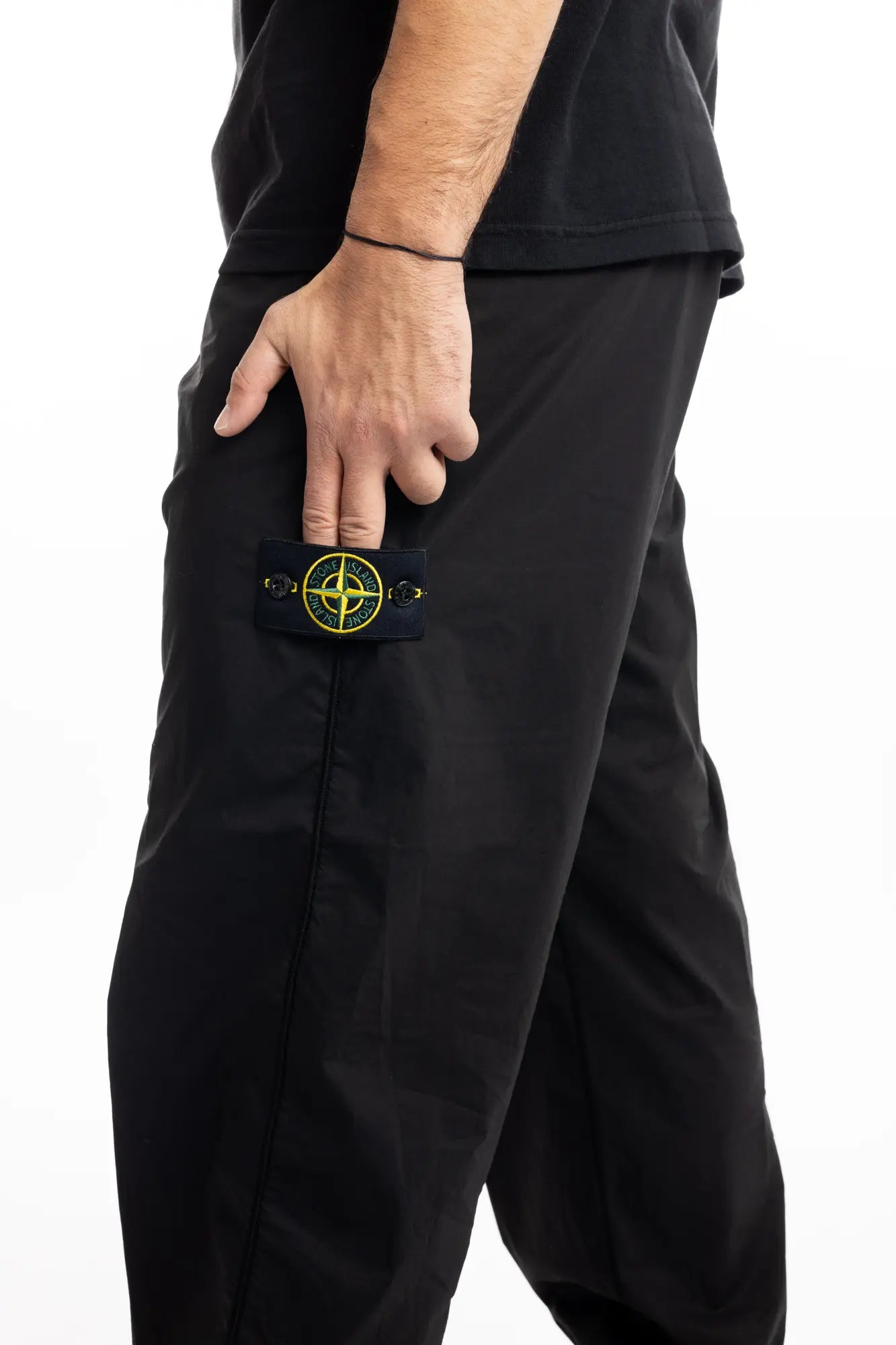 Stone Island, Mens Pants, Black, Elasticated cuffs and waistband, Compass badge, Zip Side Pockets, YKK Zippers, Badge Close-up. 