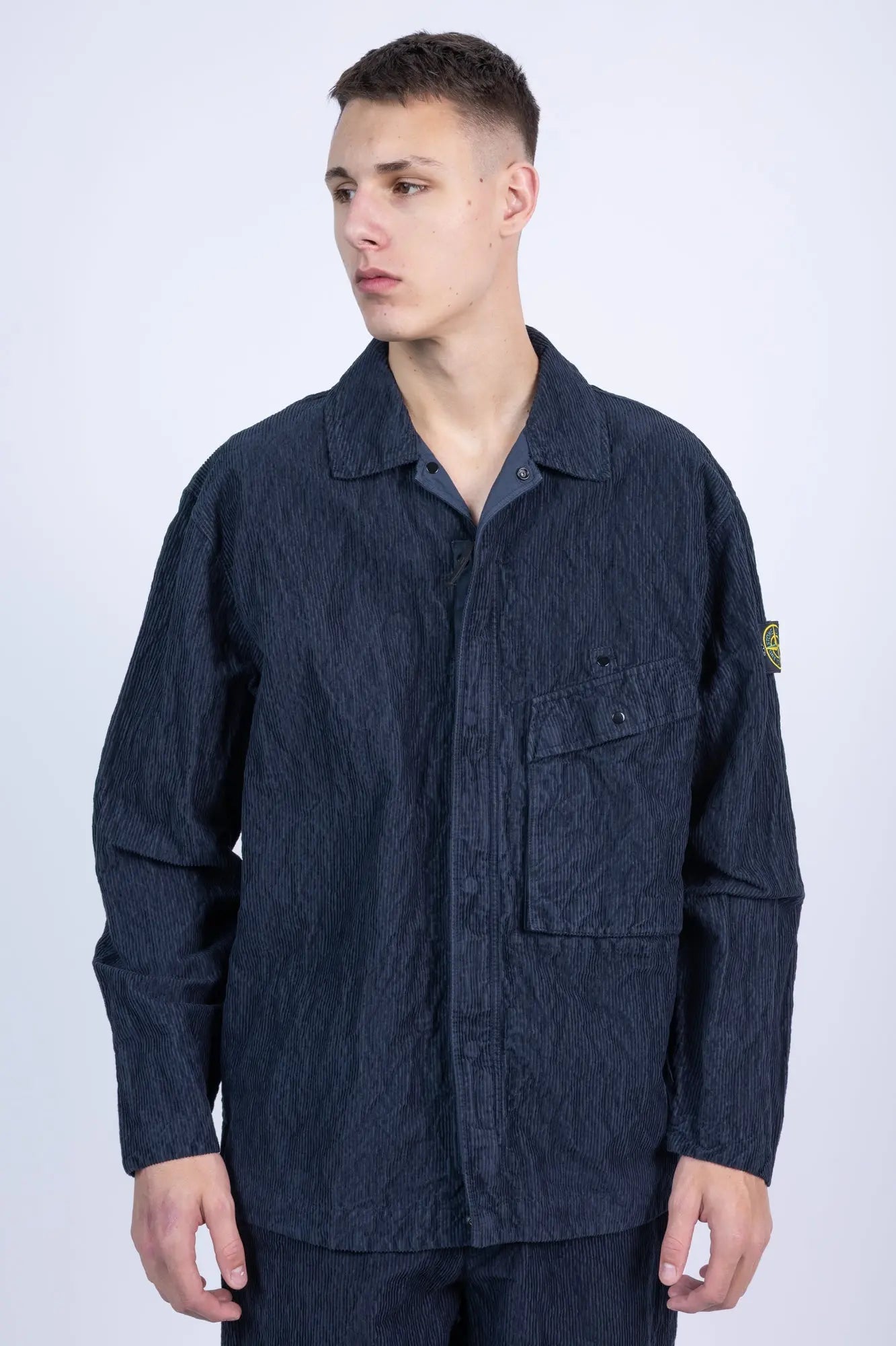 Stone Island, Mens Overshirt, Blue V0020, Chest Pockets, Adjustable Snap Cuffs, Full Zip, Hidden Zipper, YKK Zipper, Stone Island Buttons, Compass Badge, Logo-patch, Front Portrait Looking Sideways. 