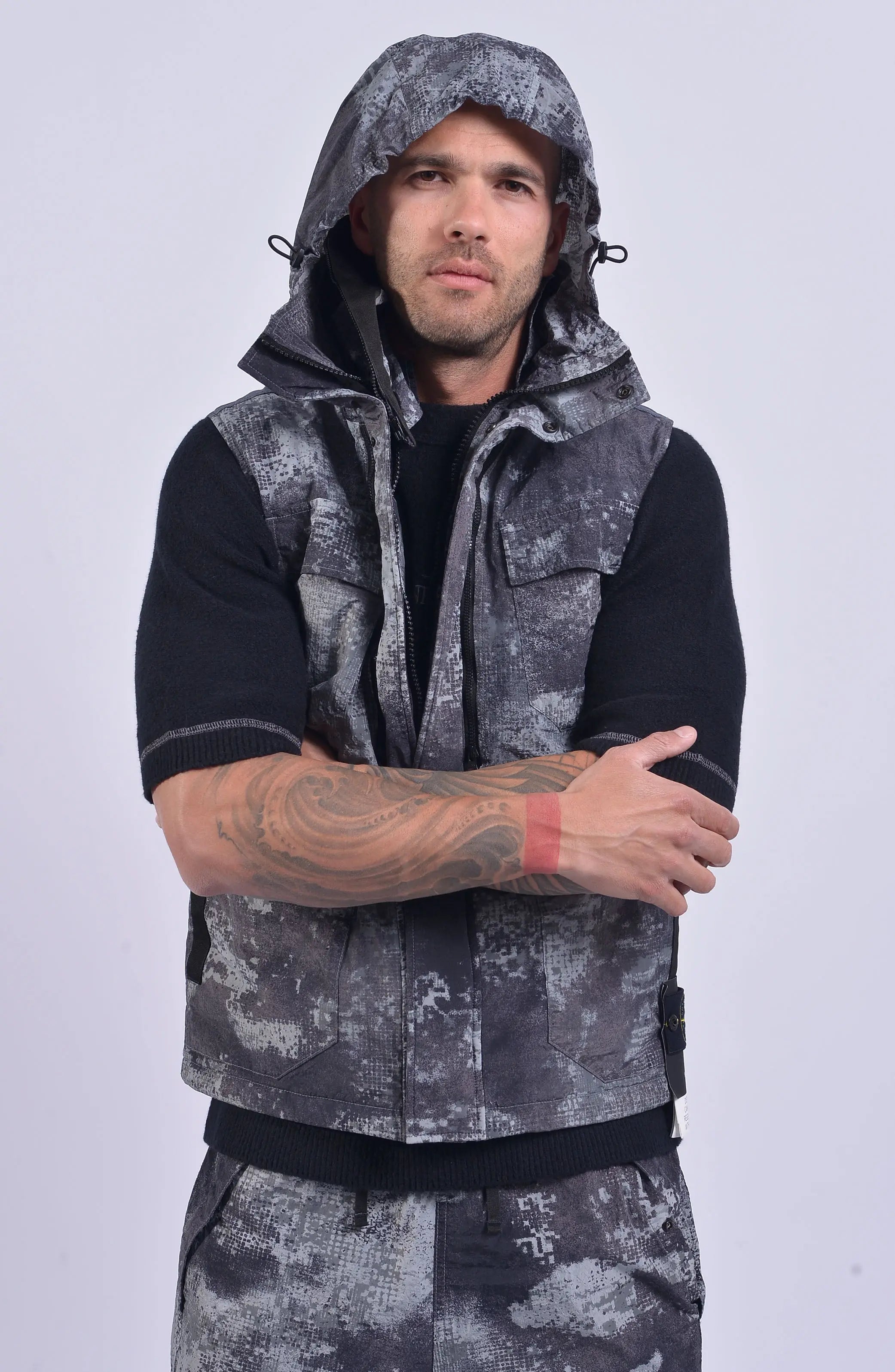 Stone Island, Mens Vest, Grey Dissolving Grid Camo, Regenerated Nylon Vest, Primaloft Padded, YKK Zippers, Velcro, Pockets, Hood, Stone Island Badge, Front Hooded Photo. 