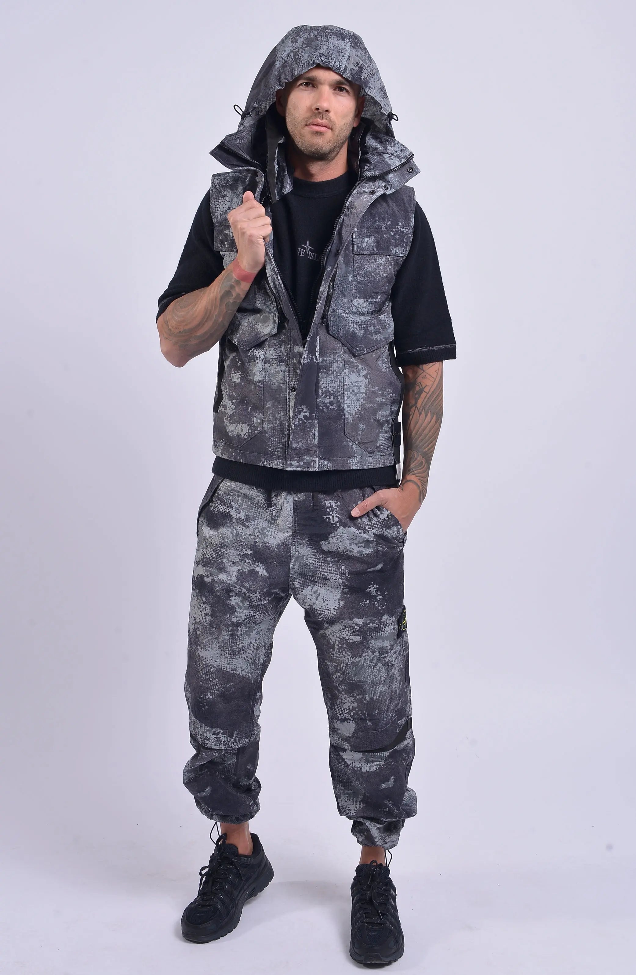 Stone Island, Mens Vest, Grey Dissolving Grid Camo, Regenerated Nylon Vest, Primaloft Padded, YKK Zippers, Velcro, Pockets, Hood, Stone Island Badge, Full Body Photo.