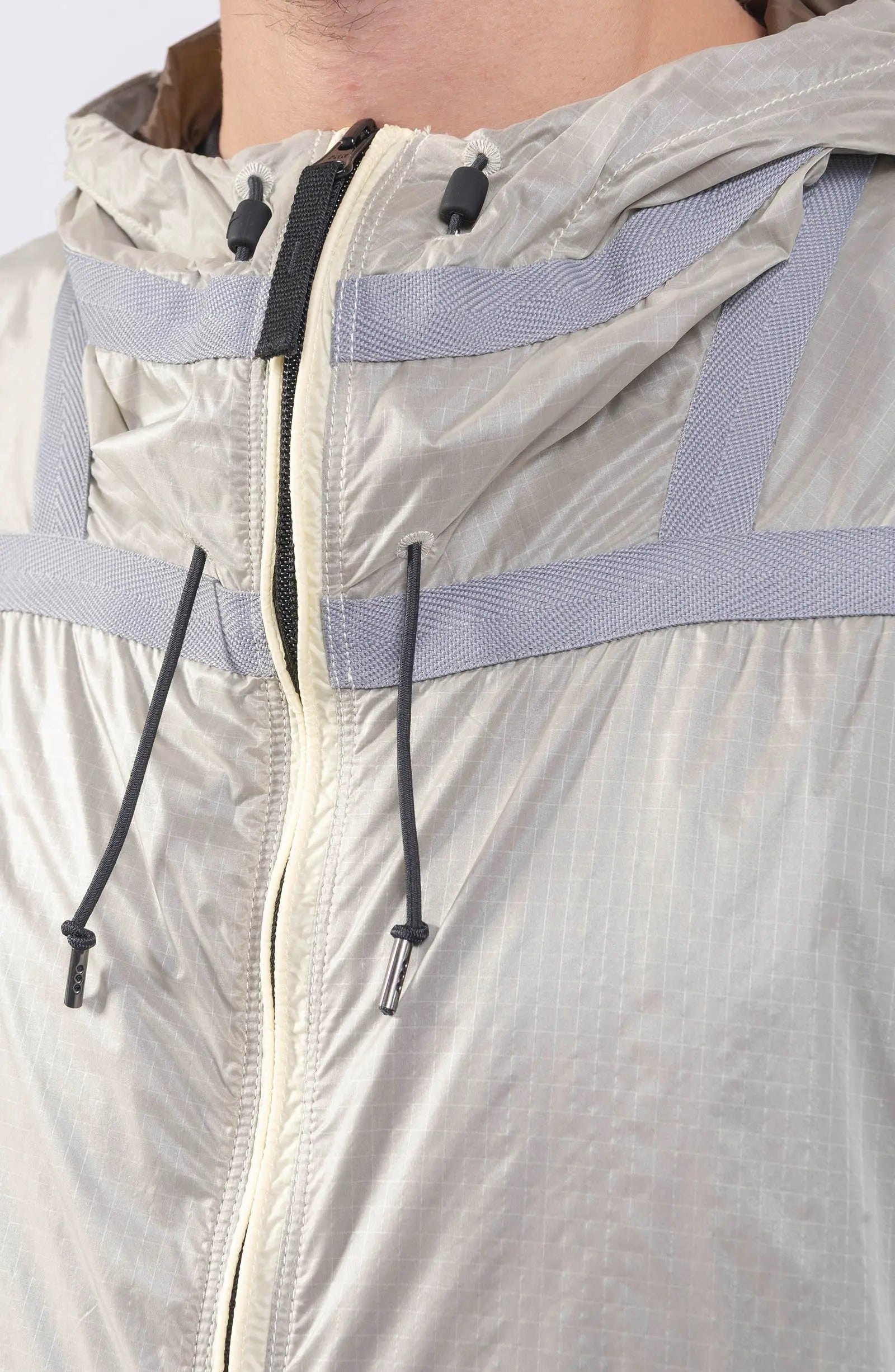 Stone Island, Mens Jacket, Windbreaker, Ivory White V0093, Semi-Transparent, Elasticated Cuffs, Full Zip, YKK Zippers, Compass Badge, Logo-Patch, Side Pockets, Hooded, Drawstring Close-up. 