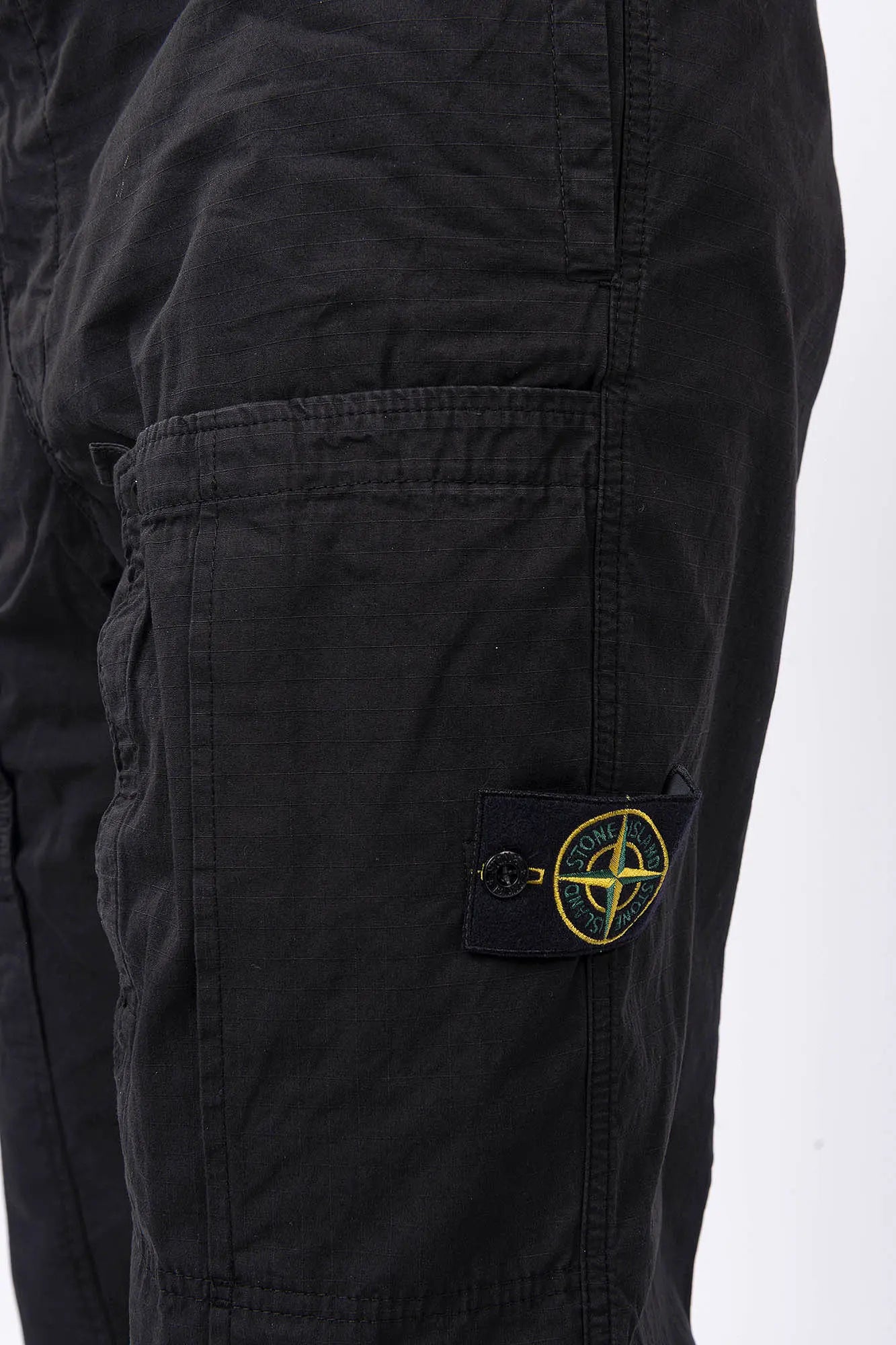 Stone Island, Mens Pants, Black V0029, Mens Trousers, Side Pockets, Welt Pockets, Snap Closure Pockets, Compass Badge, Logo-patch, Signature Side Badge, Elasticated Ankle Cuffs, Elasticated Waistband, Side Pockets, Back Pockets, Pockets and Badge Close-up. 