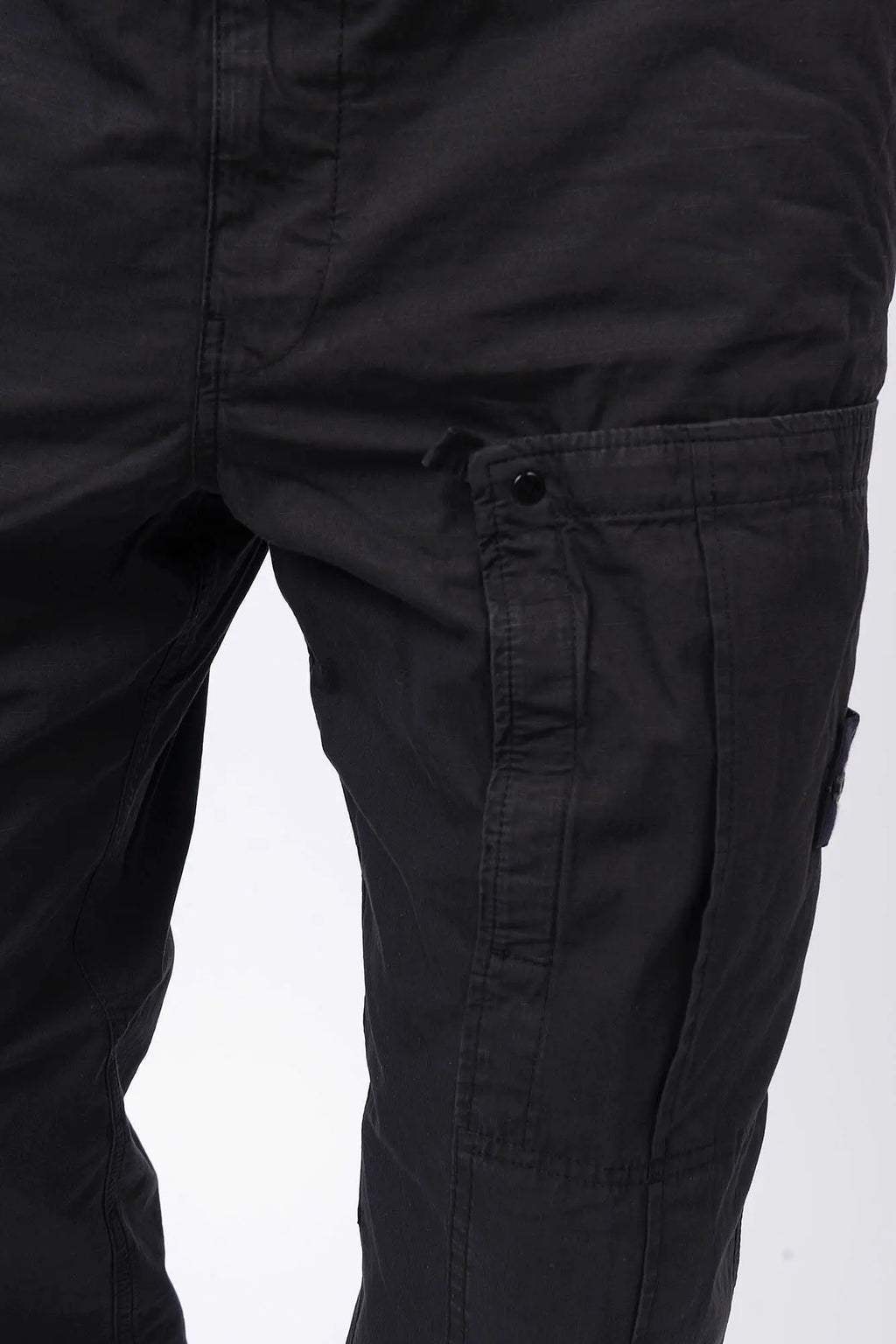 Stone Island, Mens Pants, Black V0029, Mens Trousers, Side Pockets, Welt Pockets, Snap Closure Pockets, Compass Badge, Logo-patch, Signature Side Badge, Elasticated Ankle Cuffs, Elasticated Waistband, Side Pockets, Back Pockets, Snap Closure Pocket Showcase. 