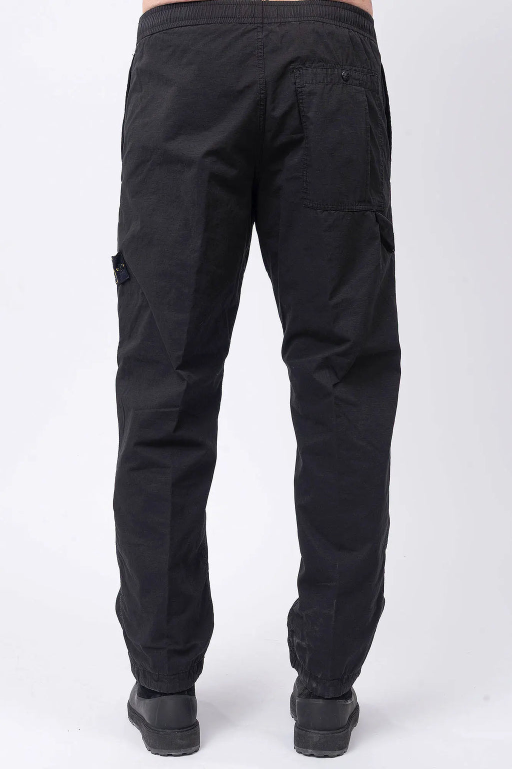 Stone Island, Mens Pants, Black V0029, Mens Trousers, Side Pockets, Welt Pockets, Snap Closure Pockets, Compass Badge, Logo-patch, Signature Side Badge, Elasticated Ankle Cuffs, Elasticated Waistband, Side Pockets, Back Pockets, Back View. 