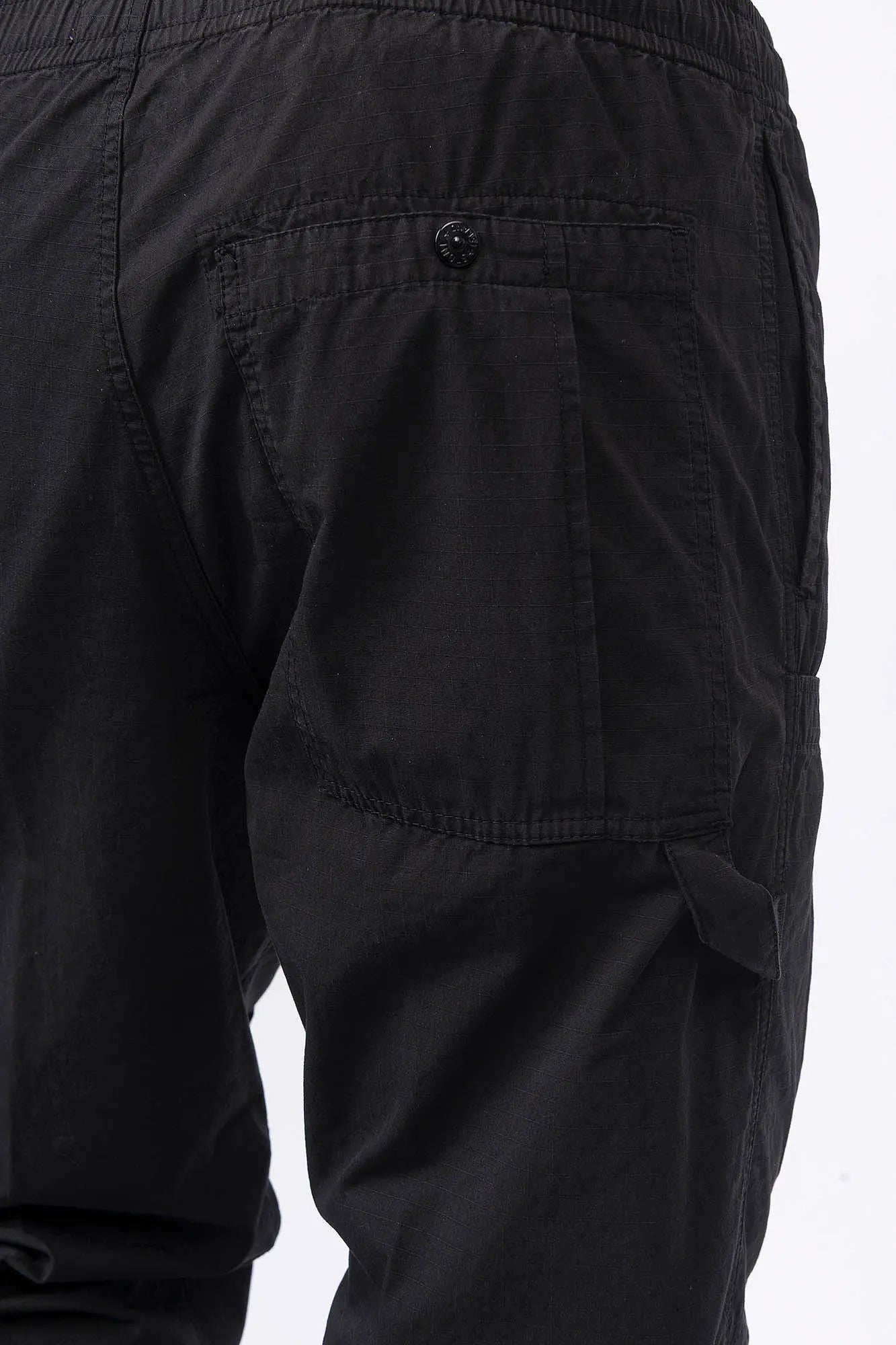 Stone Island, Mens Pants, Black V0029, Mens Trousers, Side Pockets, Welt Pockets, Snap Closure Pockets, Compass Badge, Logo-patch, Signature Side Badge, Elasticated Ankle Cuffs, Elasticated Waistband, Side Pockets, Back Pockets, Back Pocket Close-up. 