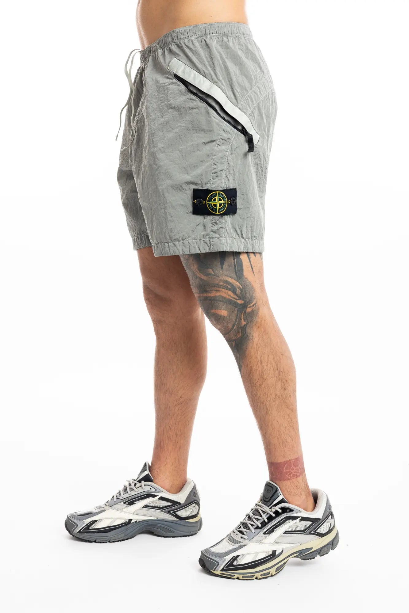 Stone Island, Mens Shorts, Grey V0061, Zip Pockets, Side Pockets, Ykk Zippers, Elasticated Waistband, Drawstring, Compass Badge, Logo-patch, Nylon Metal, Reebok Premier Road Ultra, Tattos, Side View. 