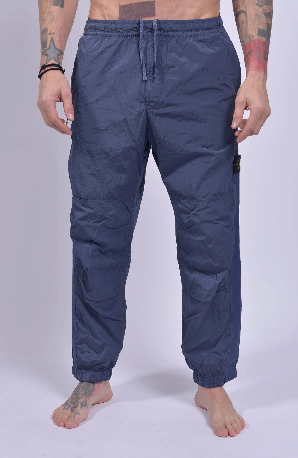 Stone Island, Mens Pants, Pastel Blue V0046, Loose Fit Joggers, Elasticated waistband, Drawstrings, Side Pockets, Compass Badge, Elasticated Ankles, Front Shot. 