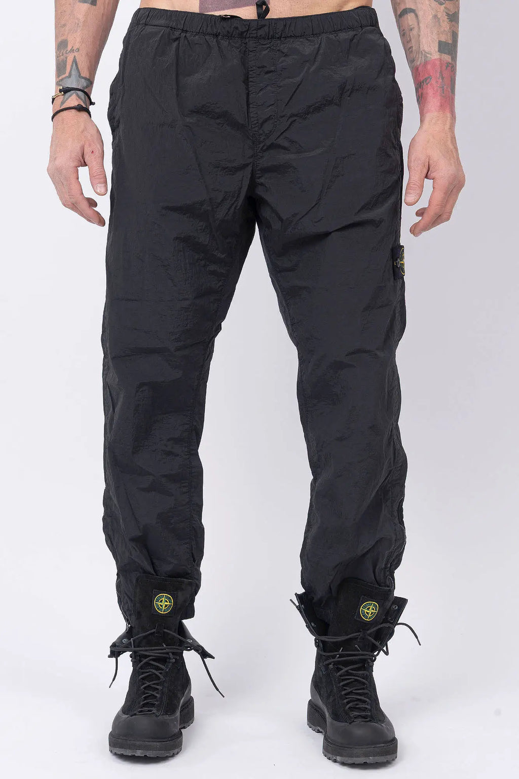 Stone Island, Mens Pants, Mens Trousers, Black V0029, Regular Fit, Tapered Legs, Side Pockets, Vertical Welt Pockets, Back Pockets, Elaticated Waistband, Drawstring Waist, Compass Badge, Logo-patch, Signature Side Badge, Front View. 