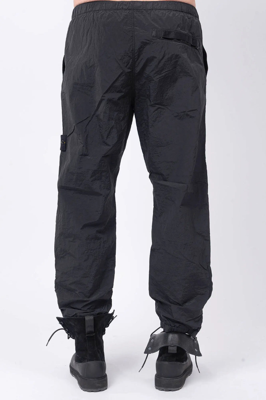 Stone Island, Mens Pants, Mens Trousers, Black V0029, Regular Fit, Tapered Legs, Side Pockets, Vertical Welt Pockets, Back Pockets, Elaticated Waistband, Drawstring Waist, Compass Badge, Logo-patch, Signature Side Badge, Back View. 