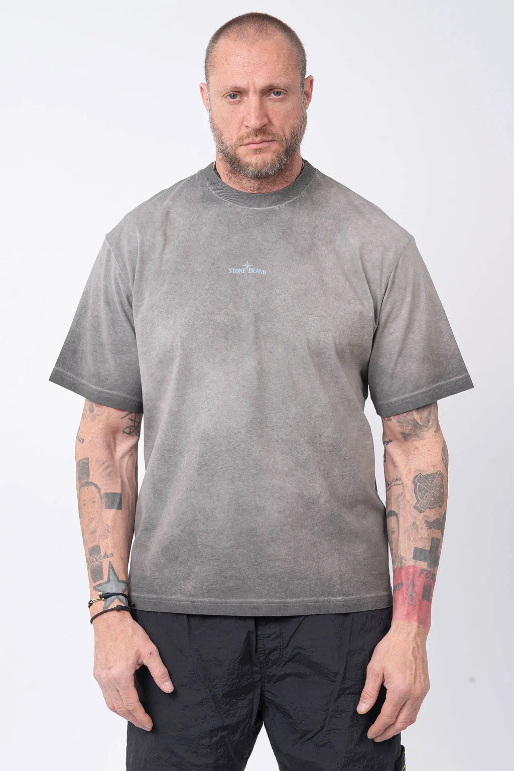 Stone Island, Mens T-Shirt, Black V0029, Uneven Cold Dyed, Front and Back Print, Wide Fit, Ribbed Hem, Ribbed Cuffs, Ribbed Neck, 100% Cotton, Organic Cotton, Blue Print, Graphic Back Print with Compass Logo, Logo-patch, Crew Neck, Round Neckline, Front Portrait. 