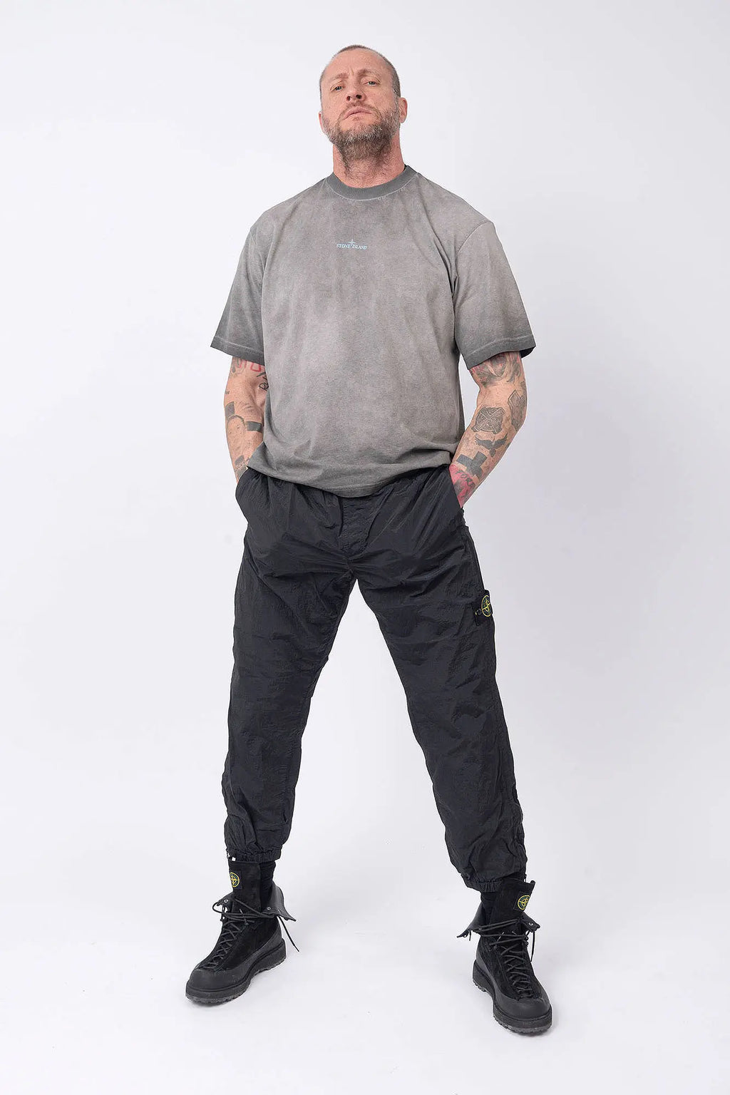 Stone Island, Mens T-Shirt, Black V0029, Uneven Cold Dyed, Front and Back Print, Wide Fit, Ribbed Hem, Ribbed Cuffs, Ribbed Neck, 100% Cotton, Organic Cotton, Blue Print, Graphic Back Print with Compass Logo, Logo-patch, Crew Neck, Round Neckline, Full Body Front View. 