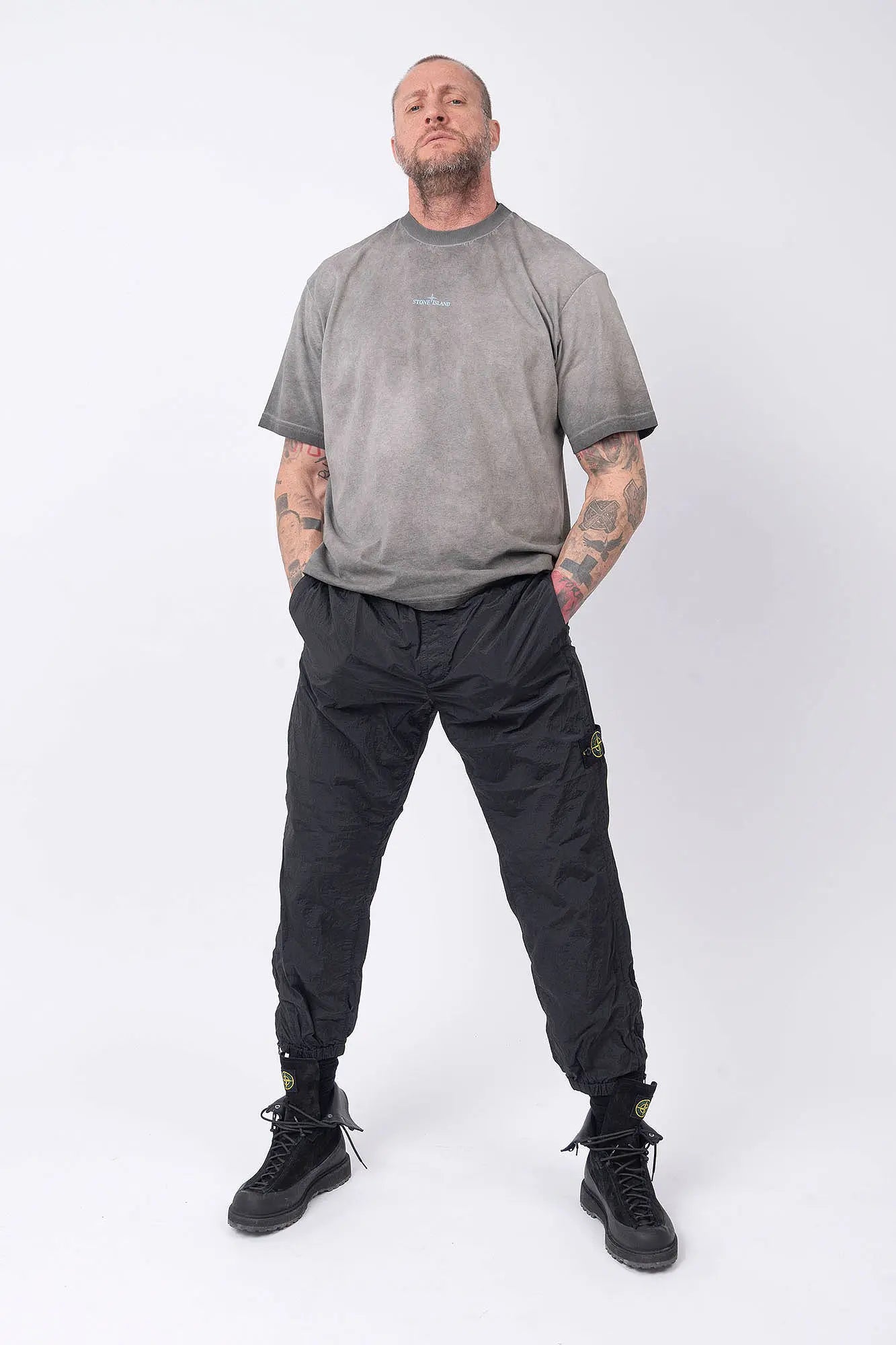 Stone Island, Mens T-Shirt, Black V0029, Uneven Cold Dyed, Front and Back Print, Wide Fit, Ribbed Hem, Ribbed Cuffs, Ribbed Neck, 100% Cotton, Organic Cotton, Blue Print, Graphic Back Print with Compass Logo, Logo-patch, Crew Neck, Round Neckline, Full Body Front View. 