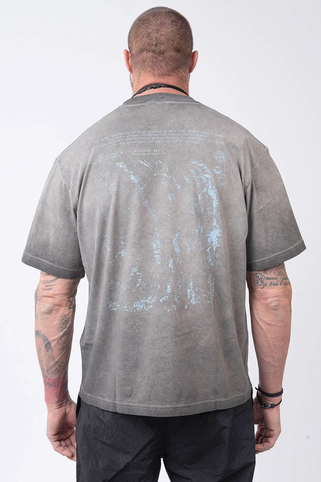 Stone Island, Mens T-Shirt, Black V0029, Uneven Cold Dyed, Front and Back Print, Wide Fit, Ribbed Hem, Ribbed Cuffs, Ribbed Neck, 100% Cotton, Organic Cotton, Blue Print, Graphic Back Print with Compass Logo, Logo-patch, Crew Neck, Round Neckline, Back Portrait. 