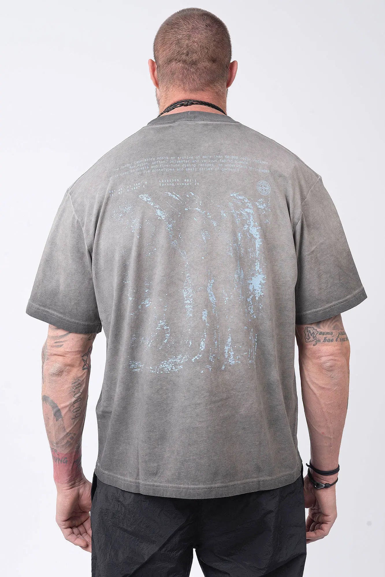 Stone Island, Mens T-Shirt, Black V0029, Uneven Cold Dyed, Front and Back Print, Wide Fit, Ribbed Hem, Ribbed Cuffs, Ribbed Neck, 100% Cotton, Organic Cotton, Blue Print, Graphic Back Print with Compass Logo, Logo-patch, Crew Neck, Round Neckline, Back Portrait. 