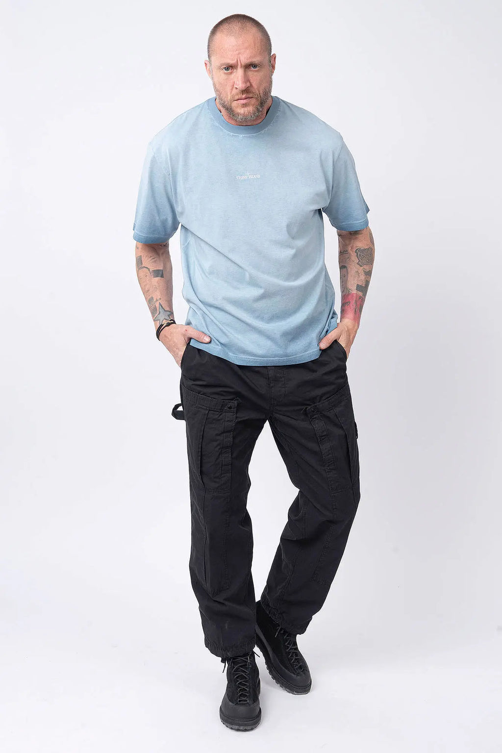 Stone Island, Mens T-Shirt, Dust Blue V004A, Uneven Cold Dyed, Front and Back Print, Wide Fit, Ribbed Hem, Ribbed Cuffs, Ribbed Neck, 100% Cotton, Organic Cotton, White Print, Graphic Back Print with Compass Logo, Logo-patch, Crew Neck, Round Neckline, Full Body Front View. 