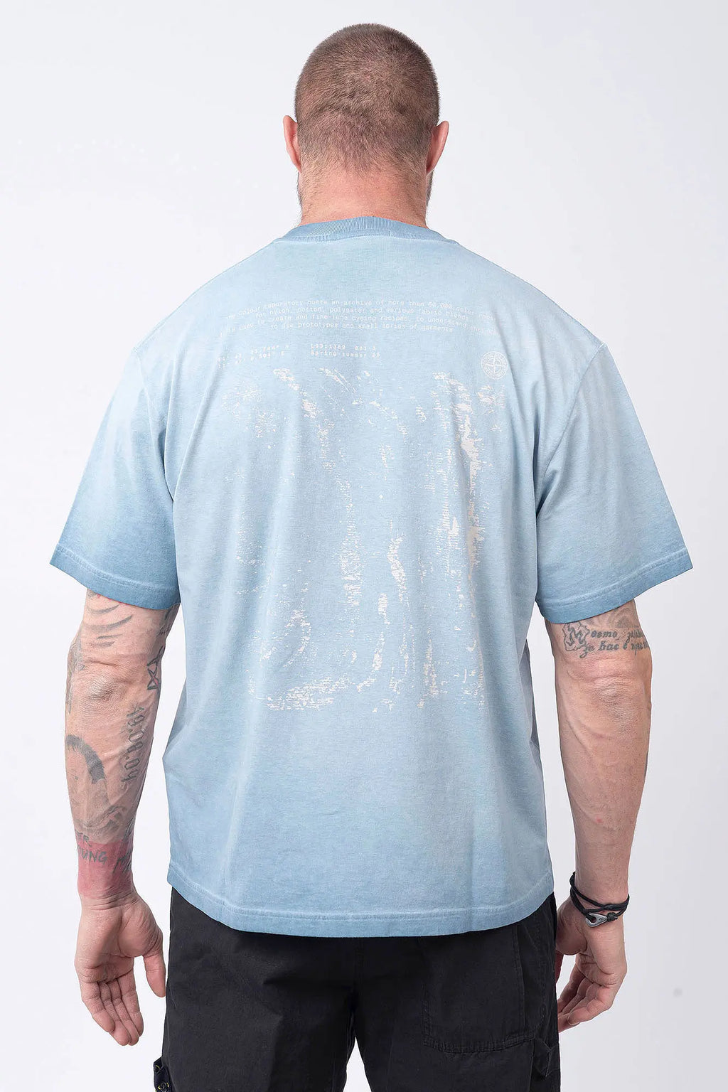 Stone Island, Mens T-Shirt, Dust Blue V004A, Uneven Cold Dyed, Front and Back Print, Wide Fit, Ribbed Hem, Ribbed Cuffs, Ribbed Neck, 100% Cotton, Organic Cotton, White Print, Graphic Back Print with Compass Logo, Logo-patch, Crew Neck, Round Neckline, Back Portrait. 