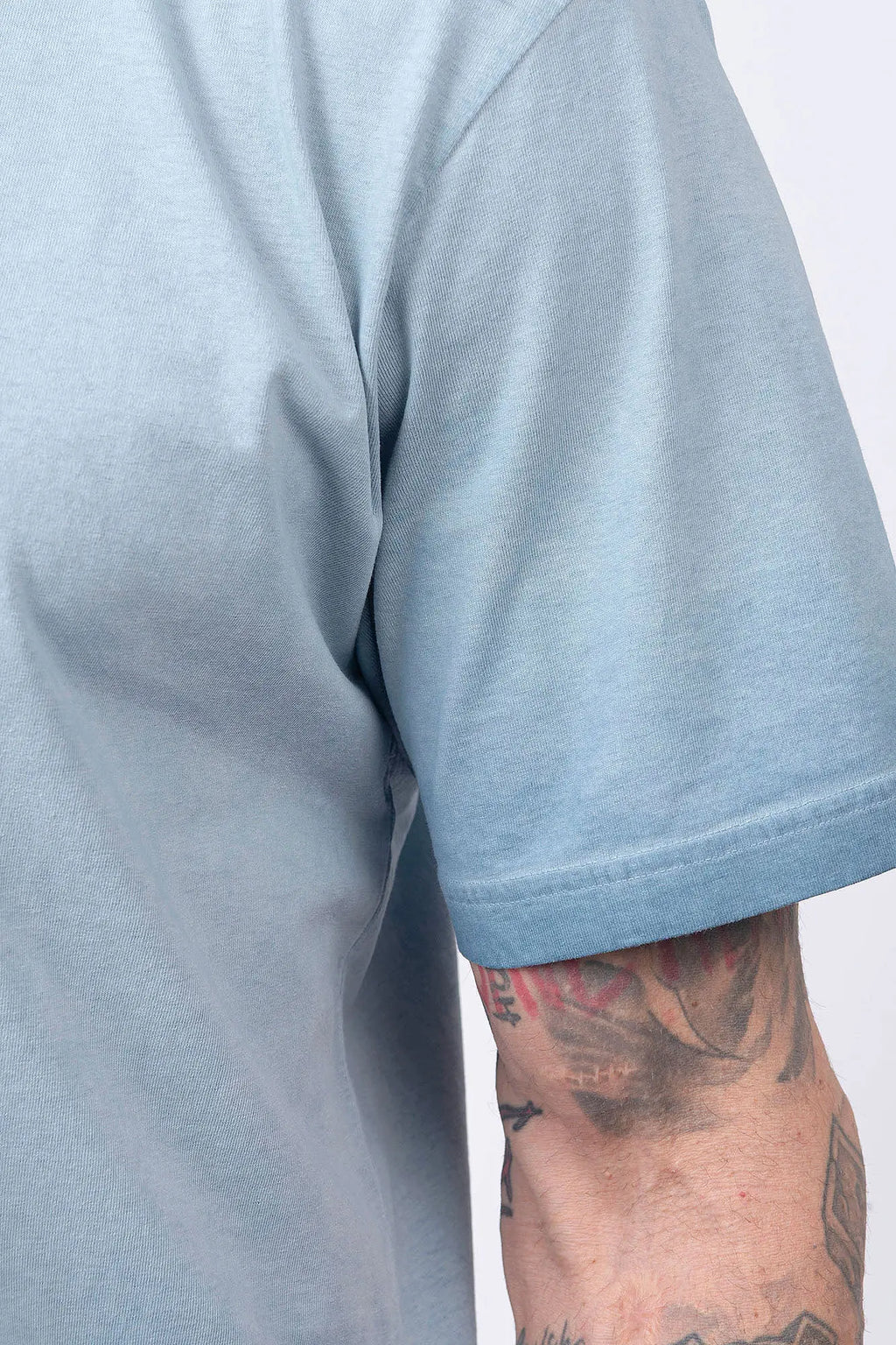 Stone Island, Mens T-Shirt, Dust Blue V004A, Uneven Cold Dyed, Front and Back Print, Wide Fit, Ribbed Hem, Ribbed Cuffs, Ribbed Neck, 100% Cotton, Organic Cotton, White Print, Graphic Back Print with Compass Logo, Logo-patch, Crew Neck, Round Neckline, Cold Dyeing Effect. 
