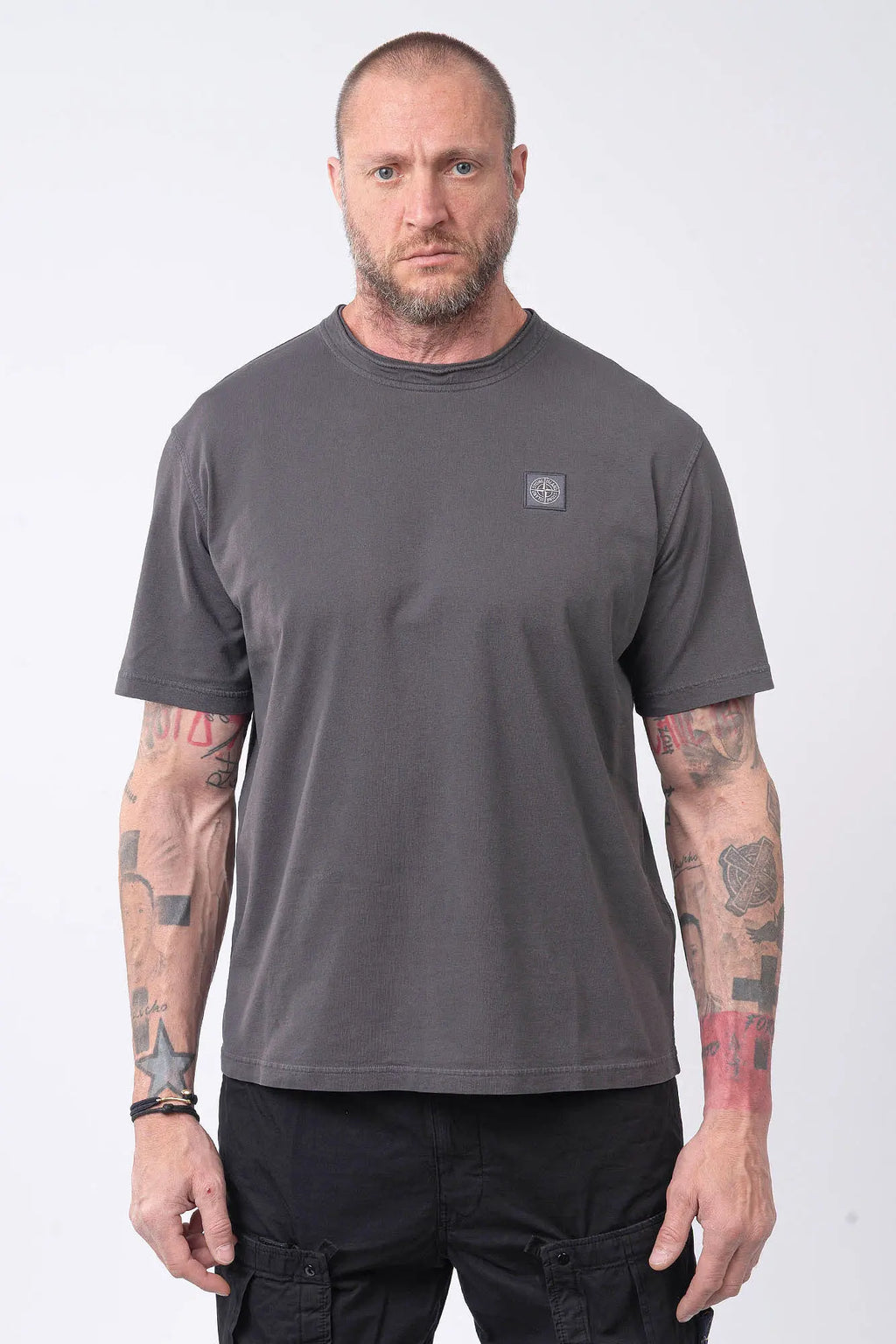 Stone Island, Mens T-Shirt, Charcoal V0165, Grey, Gray, Garment Dyed, Short Sleeves, Elastic Ribbing, Organic Cotton, Wide Fit, Raw-cut Neck, Crewneck, Round Neck, Compass Badge, Logo-patch, Chest Compass Patch, Front Portrait. 