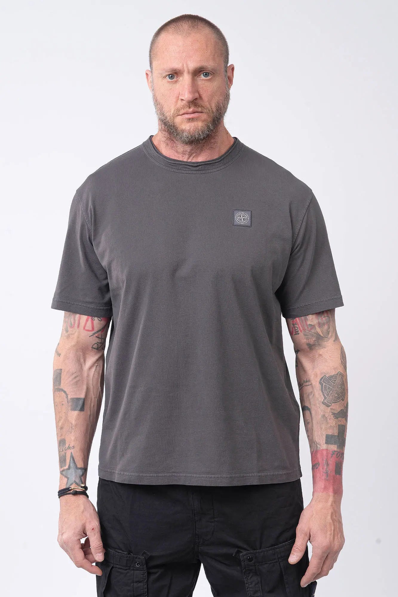 Stone Island, Mens T-Shirt, Charcoal V0165, Grey, Gray, Garment Dyed, Short Sleeves, Elastic Ribbing, Organic Cotton, Wide Fit, Raw-cut Neck, Crewneck, Round Neck, Compass Badge, Logo-patch, Chest Compass Patch, Front Portrait. 