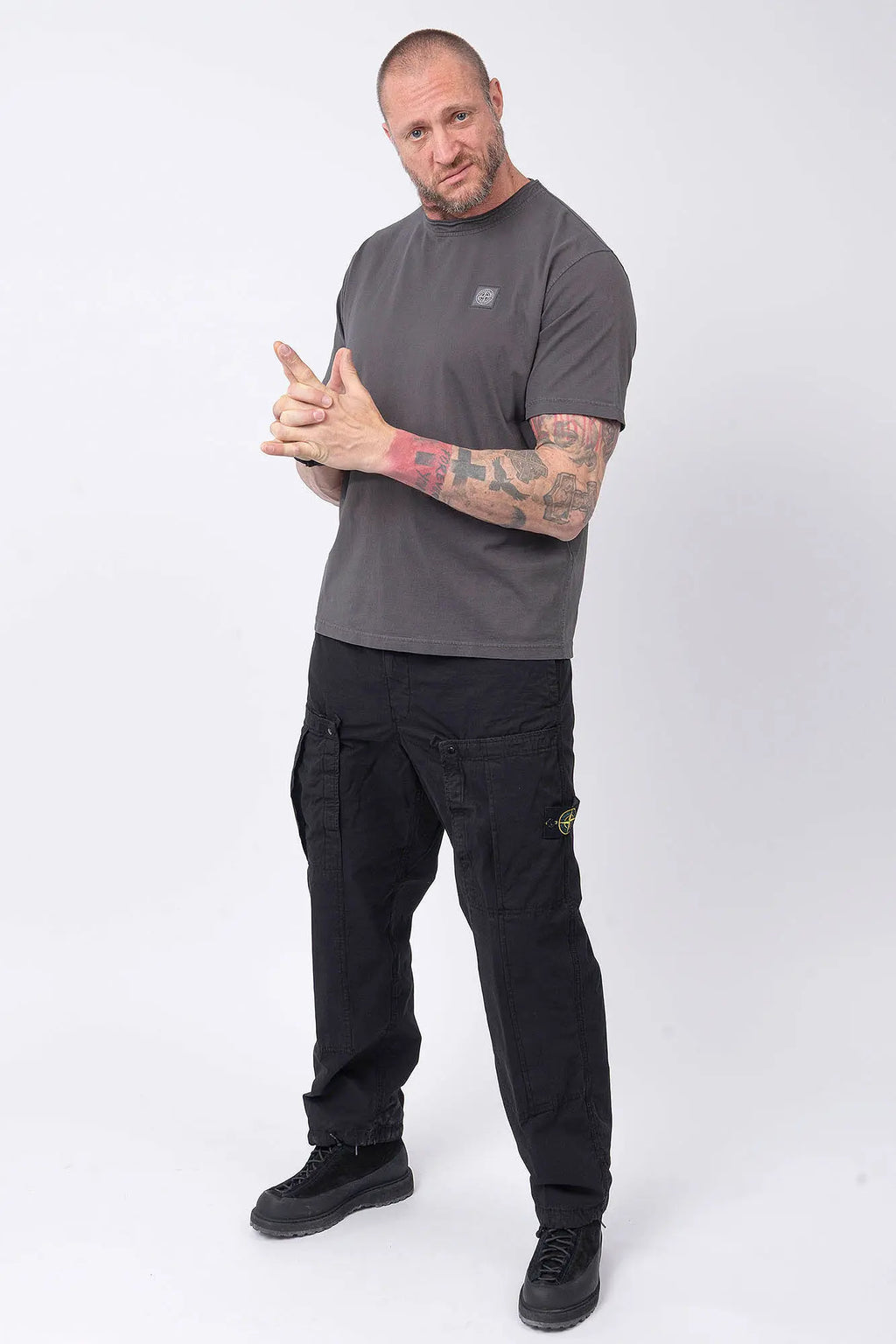 Stone Island, Mens T-Shirt, Charcoal V0165, Grey, Gray, Garment Dyed, Short Sleeves, Elastic Ribbing, Organic Cotton, Wide Fit, Raw-cut Neck, Crewneck, Round Neck, Compass Badge, Logo-patch, Chest Compass Patch, Full Body Front 3/4 View Pointing Forward. 