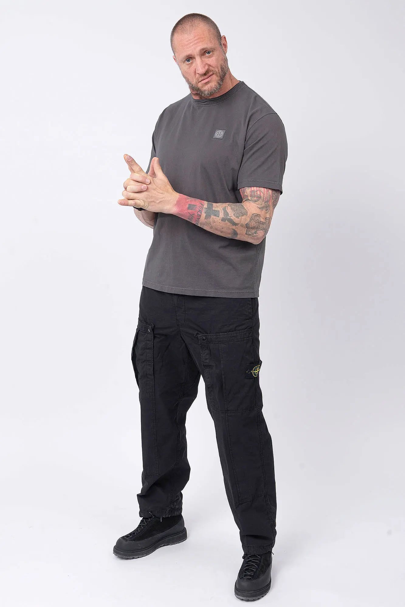 Stone Island, Mens T-Shirt, Charcoal V0165, Grey, Gray, Garment Dyed, Short Sleeves, Elastic Ribbing, Organic Cotton, Wide Fit, Raw-cut Neck, Crewneck, Round Neck, Compass Badge, Logo-patch, Chest Compass Patch, Full Body Front 3/4 View Pointing Forward. 