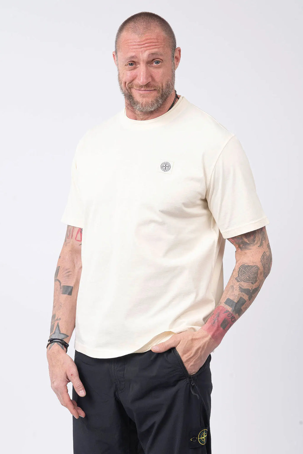 Stone Island, Mens T-Shirt, Ivory V0193, Off-White, White, Garment Dyed, Worn Effect, Short Sleeves, Elastic Ribbing, Organic Cotton, Wide Fit, Raw-cut Neck, Crewneck, Round Neck, Compass Badge, Logo-patch, Chest Compass Patch, Front Portrait Hand in Pocket. 