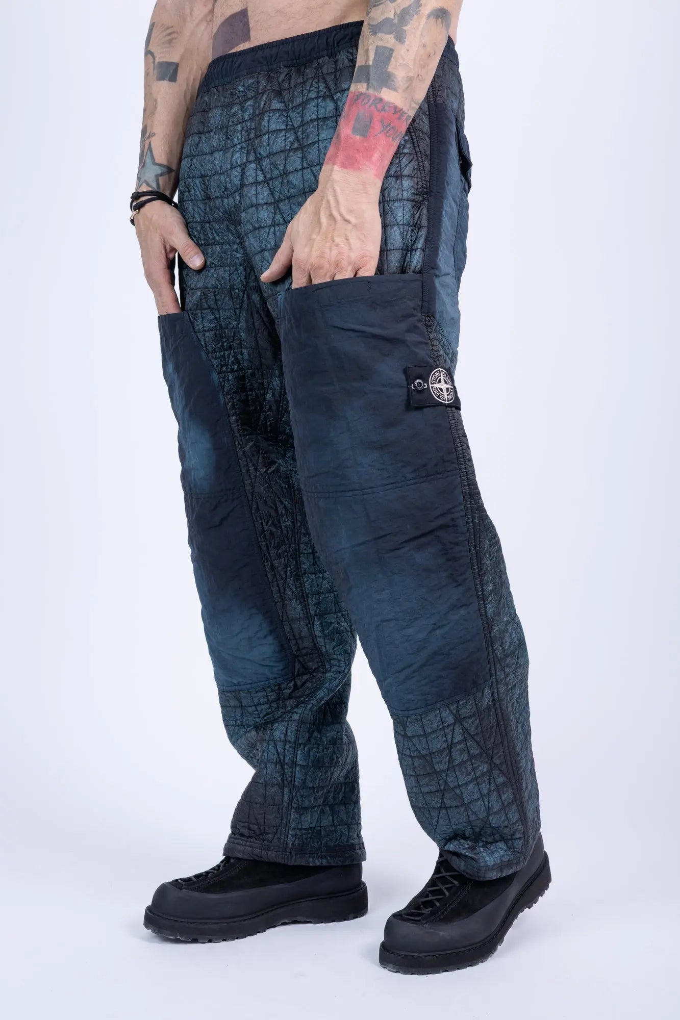 Stone Island, Mens Pants, Blue on Black V0029, Corrosion Treated, Compass Badge, Logo-patch, Limited Edition Stone Island Logo, Elasticated Cuffs, Side Pockets, Hands in Pockets 3/4 Photo. 