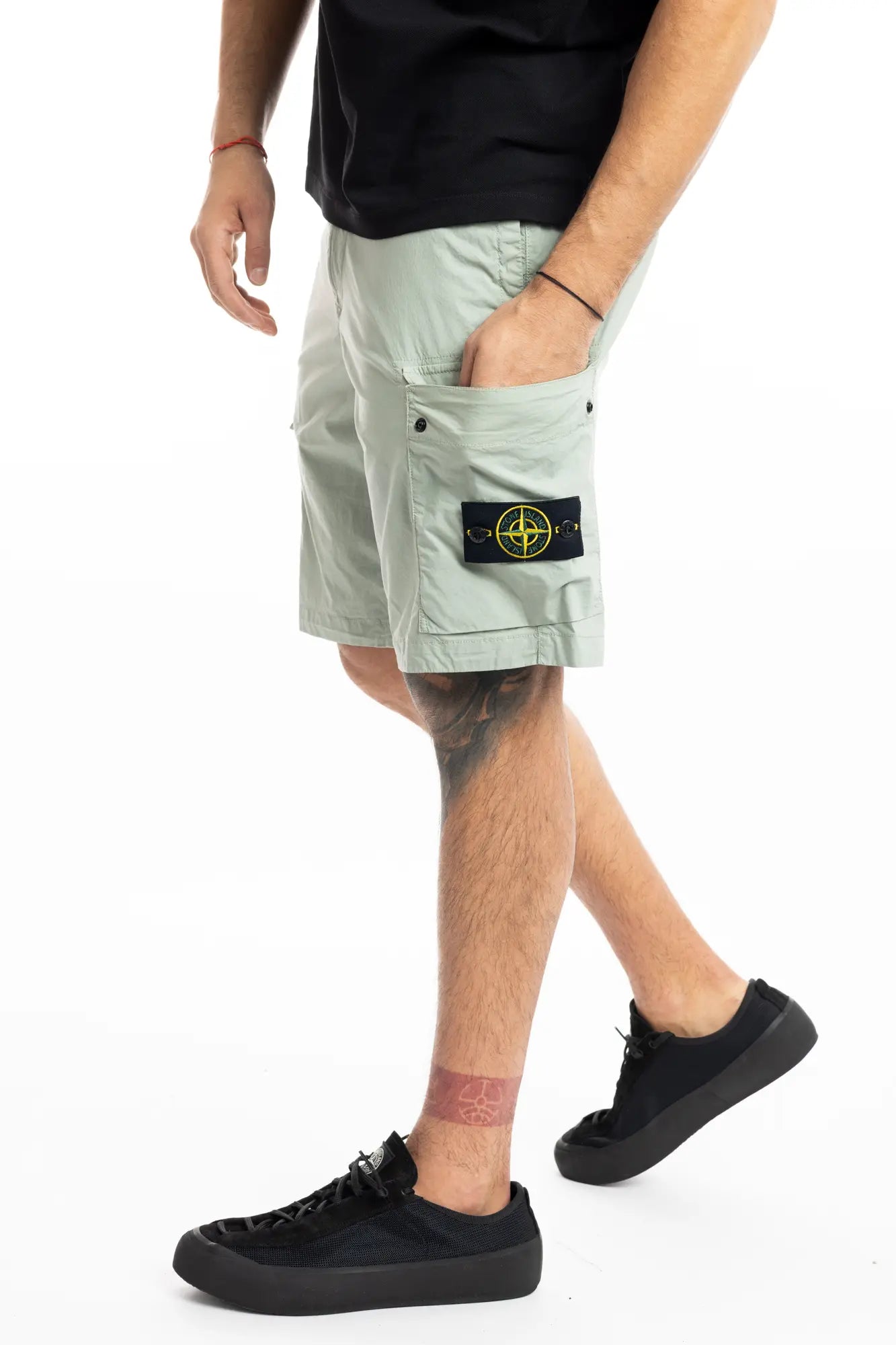 Stone Island, Mens Bermuda Shorts, Sage Green S0055, Compass Badge, Logo-patch, Side Flap Pockets, Stone Island Buttons, Belt Loops, Light Stretch Cotton Tela, Zip Fly, YKK Zipper, 3/4 Front View. 