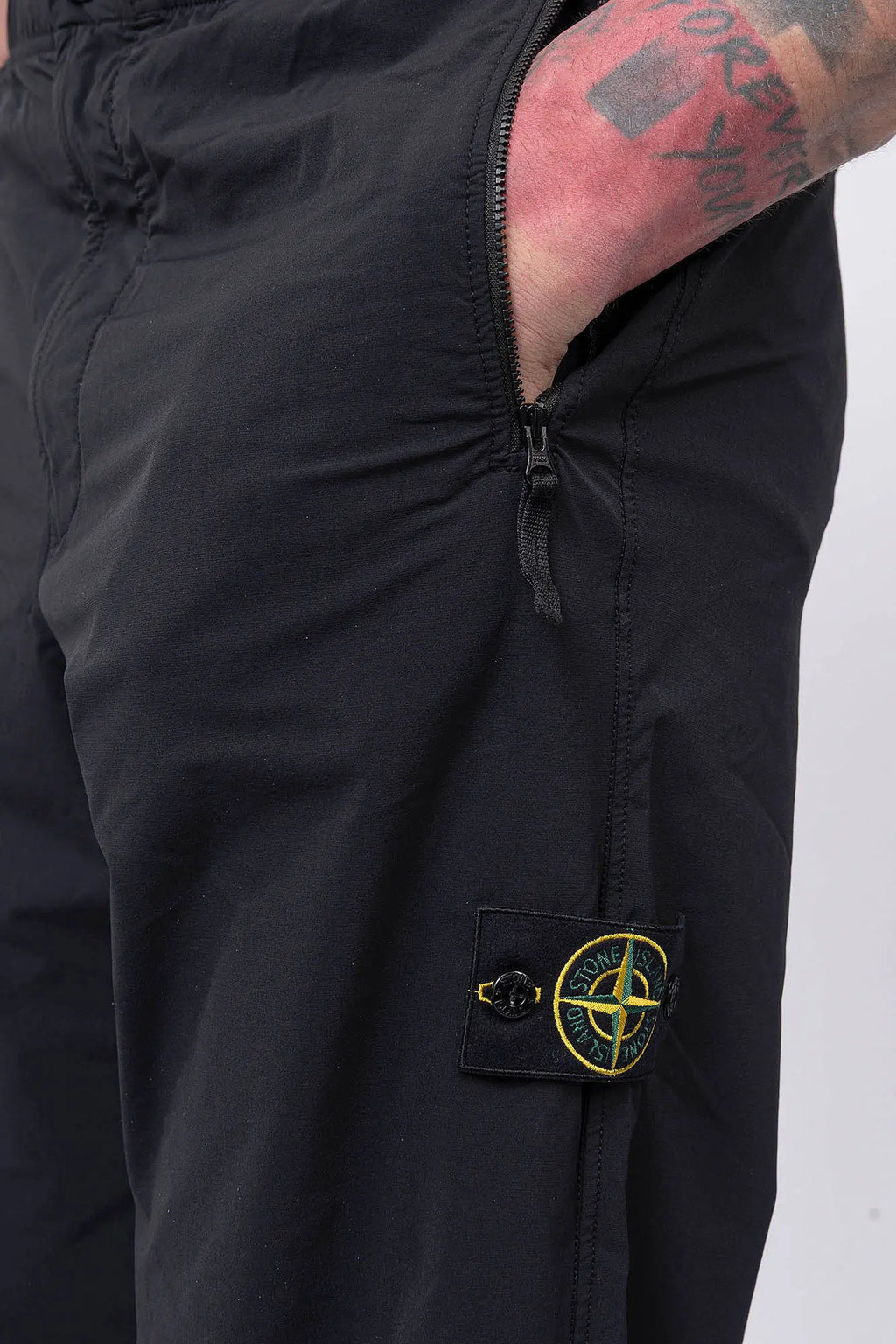 Stone Island, Mens Pants, Mens Trousers, Black V0029, Compass Badge, Logo-patch, Side Zip Pockets, YKK Vislon Zippers, Stone Island Button, Zip-Fly, Elasticated Drawsting Waist, Elastic Adjustable Cuffs, Signature Stone Island Badge, Back Pockets, Left Hand in Pocket. 