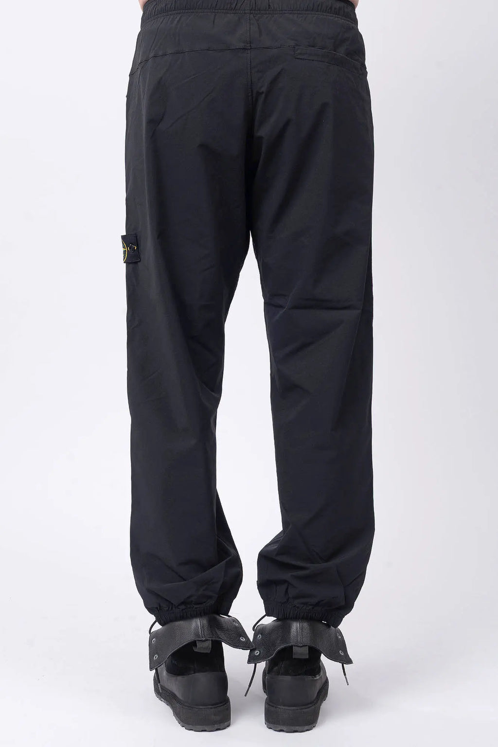 Stone Island, Mens Pants, Mens Trousers, Black V0029, Compass Badge, Logo-patch, Side Zip Pockets, YKK Vislon Zippers, Stone Island Button, Zip-Fly, Elasticated Drawsting Waist, Elastic Adjustable Cuffs, Signature Stone Island Badge, Back Pockets, Back View. 