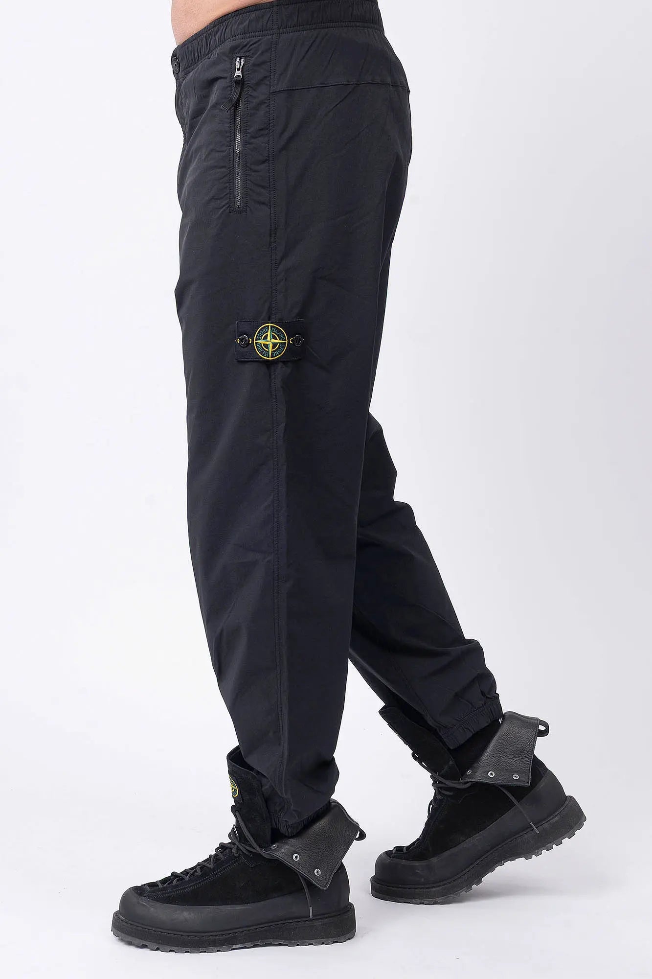 Stone Island, Mens Pants, Mens Trousers, Black V0029, Compass Badge, Logo-patch, Side Zip Pockets, YKK Vislon Zippers, Stone Island Button, Zip-Fly, Elasticated Drawsting Waist, Elastic Adjustable Cuffs, Signature Stone Island Badge, Back Pockets, Side View Step Forward. 