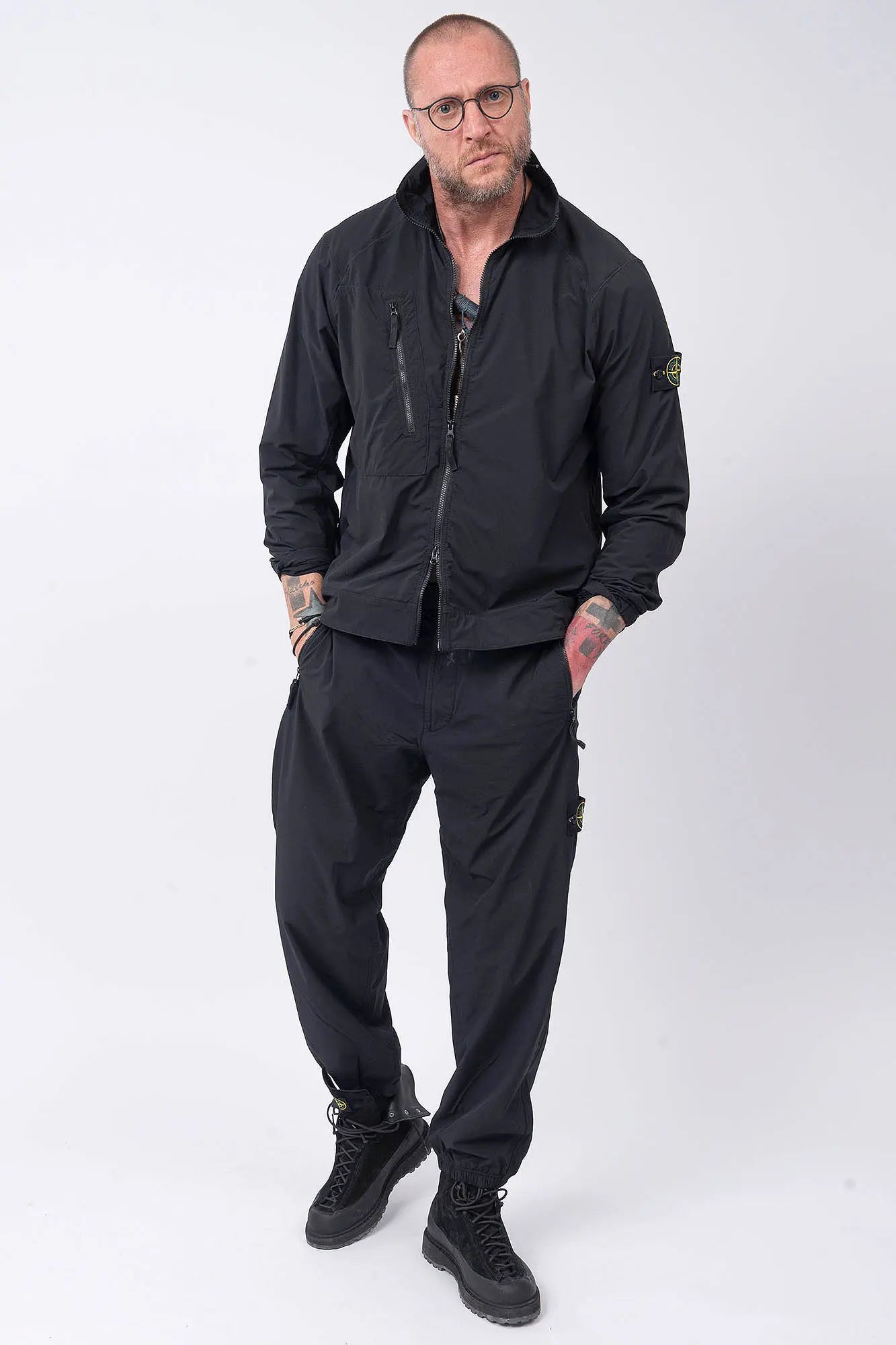 Stone Island, Mens Overshirt, Black V0029, Chest Zip Pocket, Side Compass Badge, Stretch Nylon tech fleece, Full-Zip, Centre Zip Closure, YKK Vilson Zippers, Elastic Cuffs, Full Body Hands in Pockets Front View. 