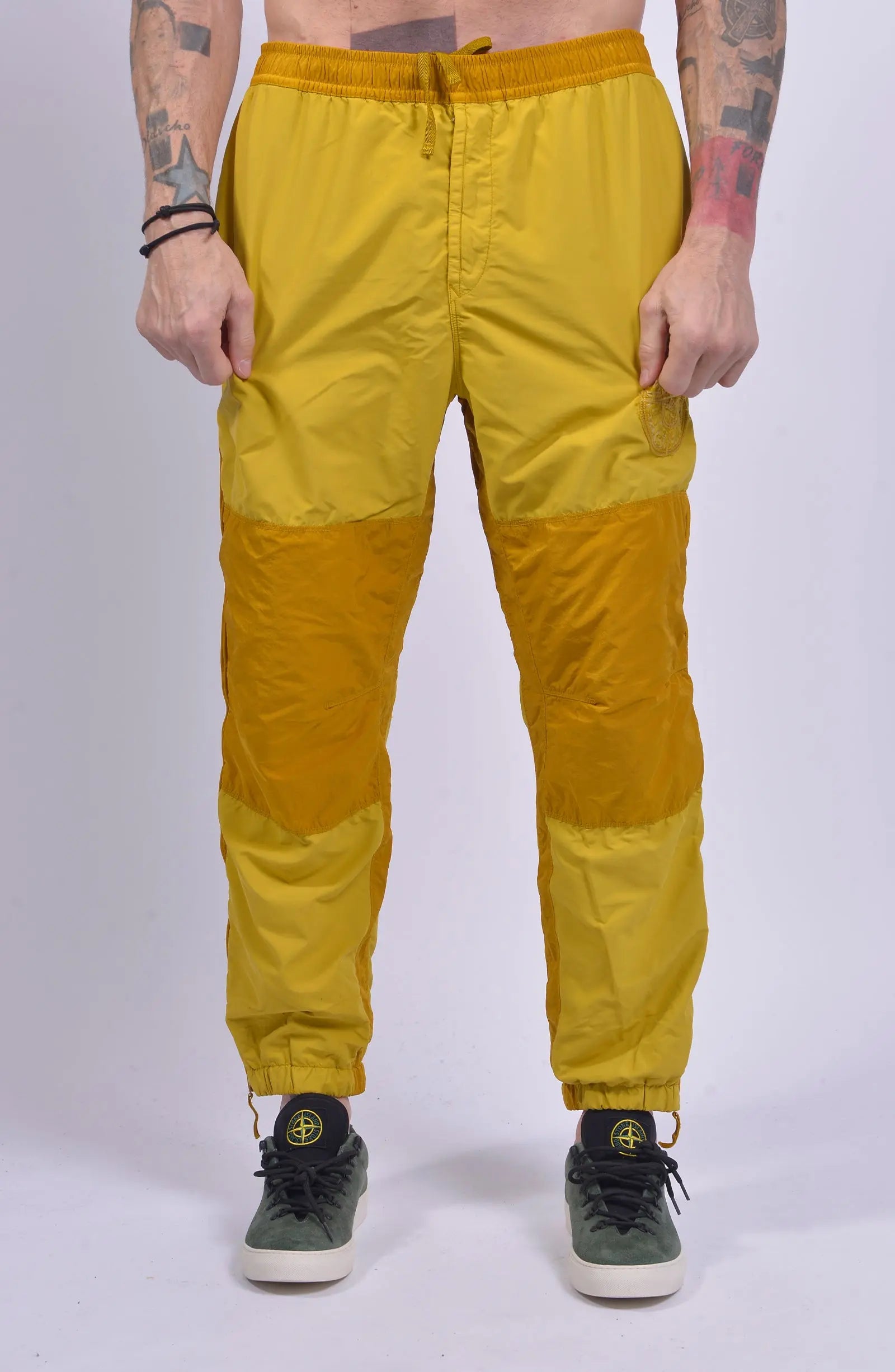 Stone Island, Mens Pants, Yellow, Orange, Elasticated Waistband, Elasticated Ankles, YKK Zippers, Zipper Pockets, Side Pockets, Compass Embroidery, Front Shot. 